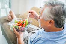 Mature Man With Pumpkin And Healthy Food, Portrait Asian Senior Man Eating A Salad In House, Old Elderly Male Health Care Eat Vegetables And Useful Foods.