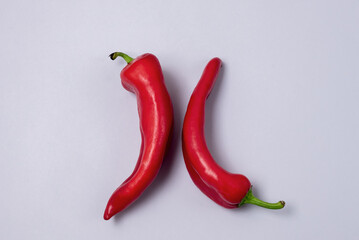 Two Red Chili Peppers on Blue Background Vegetable Horizontal Harvest