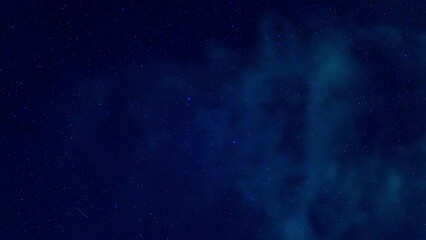 Wall Mural - beautiful timelapse of a starry night blue sky with lots of falling shining stars with clouds