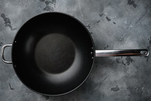 Empty Wok Skillet With Copy Space For Text Or Food With Copy Space For Text Or Food, Top View Flat Lay , On Gray Stone Table Background