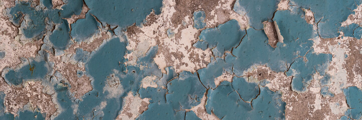  Peeling paint on the wall. Panorama of a concrete wall with old cracked flaking paint. Weathered rough painted surface with patterns of cracks and peeling. Wide panoramic grungy texture for background
