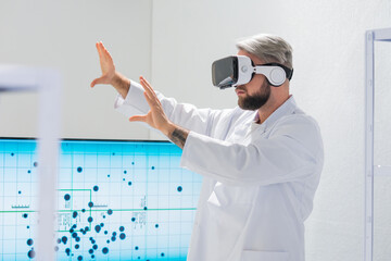 Wall Mural - genetic engineers are using virtual reality technology. professional team of scientists is working o