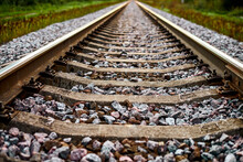 Railway Track Line Going Into Distance, Railroad Train Track With Crushed Stone, Two Parallel Rails
