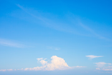 Wall Mural - blue sky with small white clouds for background usage. with copy space on top.
