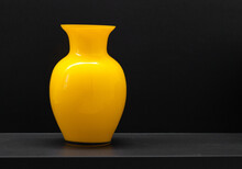 Yellow Vase On A Black Background