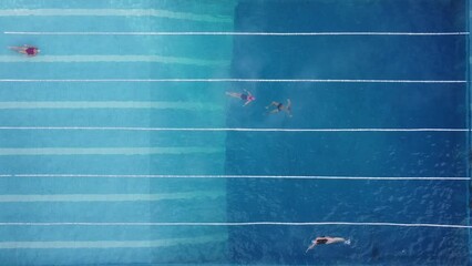 Wall Mural - Outdoor sports pool open all year round. People swim in the pool in winter. Aerial view.	