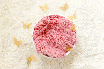 Wall Mural - Newborn photography digital background prop. Basket with fur and butterflies on a white background.