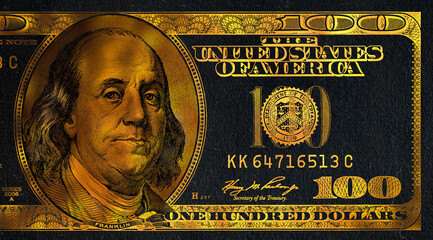 golden textured 100 US dollar banknote with black background