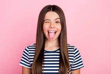 Photo Of Pretty Funny Impressed Girl Wear Striped Outfit Winking Showing Tongue Isolated Pink Color Background