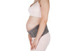 © Maksim - Pregnant woman belly in prenatal pregnancy maternity belt isolated on white background. Support waist, back, abdomen band. Belly Brace. Belly band for pregnancy. Orthopedic abdominal support belt.