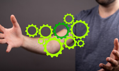 Set of green gears and cogs on black background