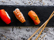 Nigiri sushi set, close-up. Fresh salmon, white fish, and shrimp on rice