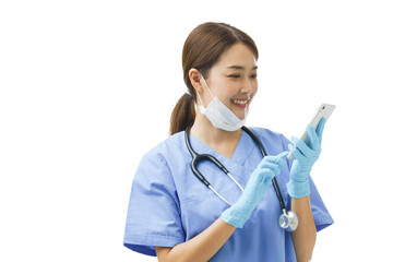 Young Asian woman doctor nurse wearing a surgical mask on her chin smiling at mobile phone consulting giving instruction and diagnose the patient health problem though online chat healthcare service.