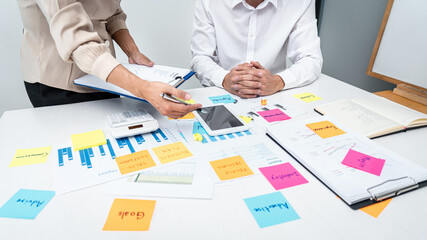 Poster - Businesswoman holding document and pointing data on tablet to explaining business report to executive