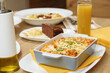 Hot dishes with pasta, cheese, vegetables and meat