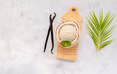 Fototapete - Coconut ice cream flavours in half of coconut setup on white stone background. Summer and Sweet menu concept.