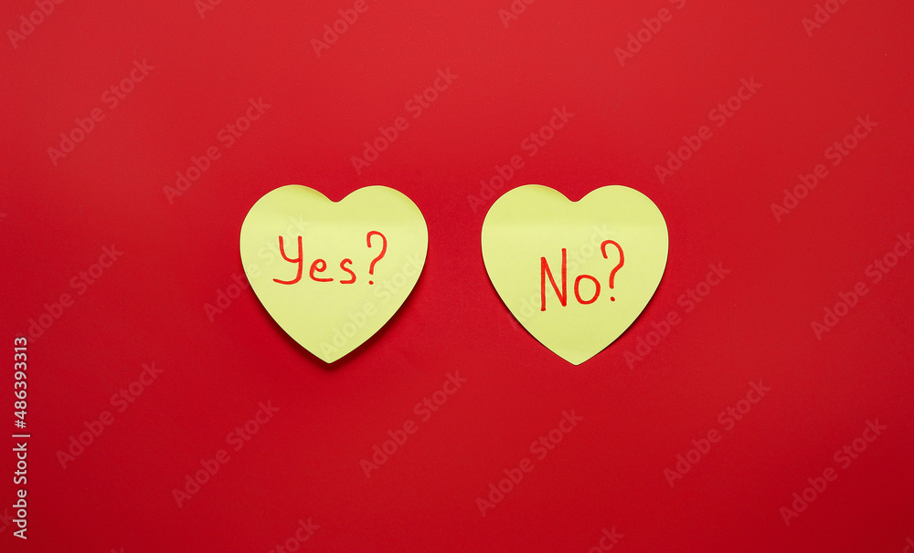 Sticky notes with questions YES and NO on red background