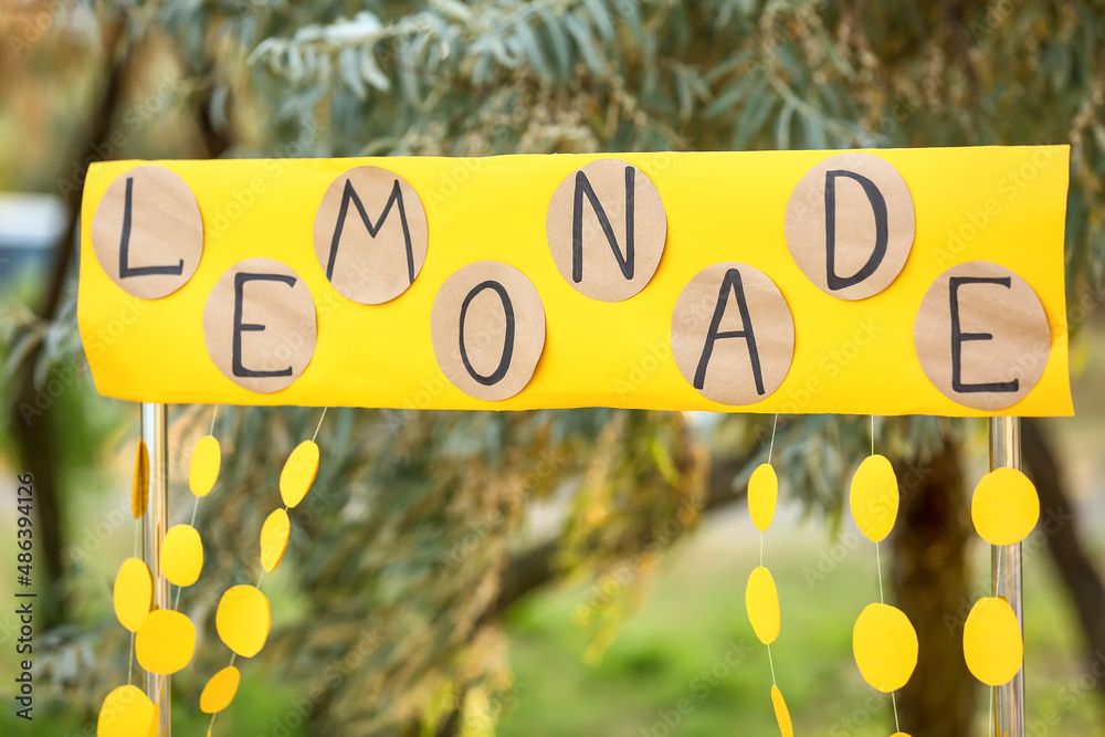Sign with word LEMONADE outdoors