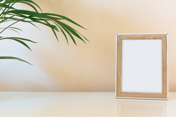 Minimalist mockup white frame board, with plant, empty background and space for text