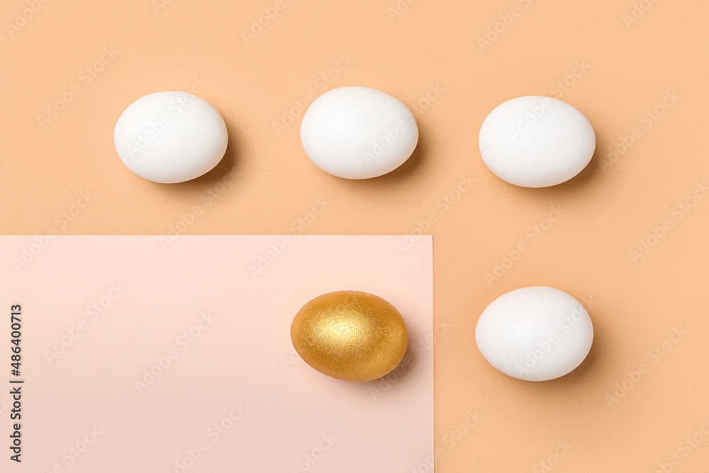 Golden Easter egg among white ones on color background