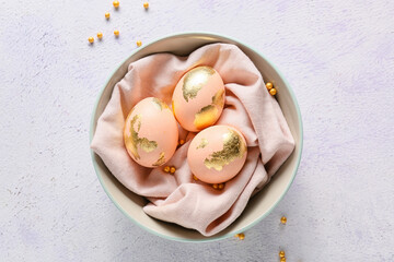 Sticker - Bowl with beautiful Easter eggs on light background