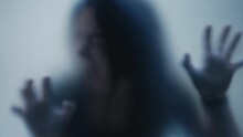 Person In Pain Behind Glass Woman Suffering From Depresson Concept Feeling Trapped Defocused Shot