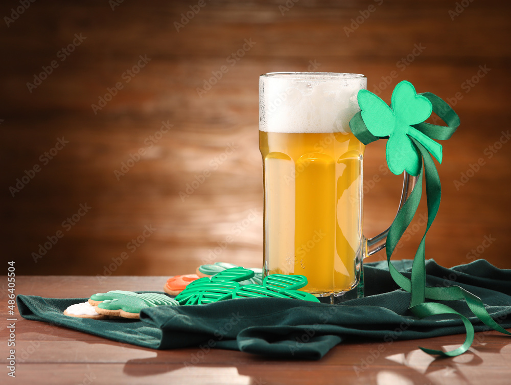 Glass of beer on wooden background. St. Patrick's Day celebration