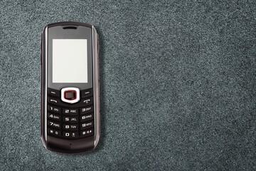 Poster - Old retro mobile phone on dark background