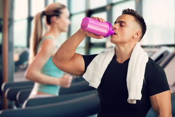 Sticker - Fitness Supplements. Happy Musculate Man Holding Container With Protein