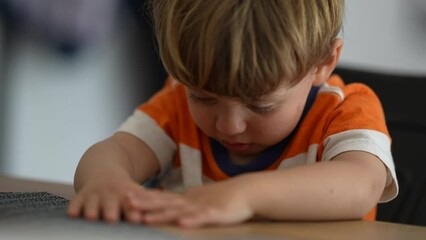 Wall Mural - Upset little boy angry child hitting table with hands