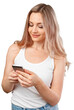 © fotofabrika - Portrait of a smiling casual woman holding smartphone over white background