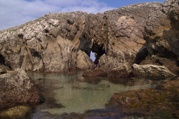 Wall Mural - Coastal part of Cantabria in the north of Spain, Costa Quebrada, ie the Broken Coast, 
around Playa de Somocuevas cove beach in Liencres
