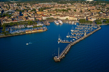 Wall Mural - Porto vecchio in Desenzano del Garda, Italy. Desenzano, lago di Garda view by drone. Desenzano del Garda in italy. Italian resorts on Lake Garda. 