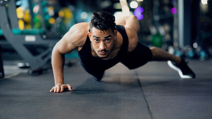 Canvas Print - Motivated Young Arab Sportsman Making Push Up Exercise On One Hand