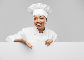 Wall Mural - cooking, advertisement and people concept - happy smiling female chef with white board over grey background