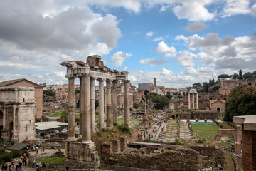 Wall Mural - View from the Capitol to the Imperial Forums, the ruins of the Basilica of Julius and the temple of Saturn and the arch of Septimius Severus. Rome, Italy