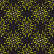 Seamless pattern with yellow abstract flowers on a black background for packaging, fabrics, backgrounds and other products.