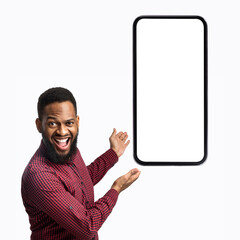 Poster - African American Guy Showing Smartphone Blank Screen Over White Background