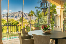 View Of A Dining Table From A Villa Terrace Overlooking The Mountains Of Marbella Along The Costa Del Sol 