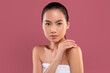 © Prostock-studio - Sensual korean lady enjoying her beauty routine, touching shoulder