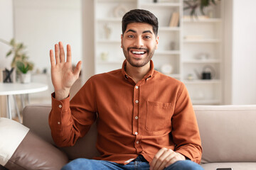 Poster - Greeting Concept. Arab man waving hand at camera