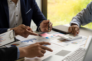 Wall Mural - Meeting with business people to discuss and brainstorm ideas on financial reports. The concept of working as a team of financial advisors and accounting, investments with a team at the office.