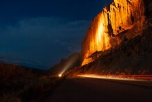 Illuminated Cliffs At Night In Utah