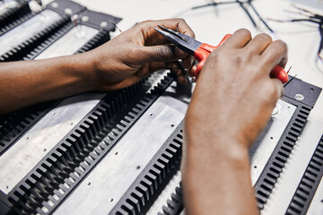 Wall Mural - hands squeezing wire with tongs
