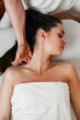 © Dusko - Beautiful young woman receiving professional body massage treatment with aromatherapy essential oil.