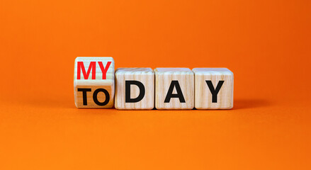 Today is my day symbol. Turned wooden cubes and changed concept words Today to My day. Beautiful orange table orange background, copy space. Business, motivation today is my day concept.