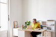 © ALTO IMAGES/Stocksy - Businesswoman having video meeting