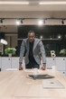 © Dreamwood videography - Mikhail Nilov/Stocksy - Lonely black man in workspace
