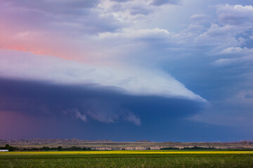 Wall Mural - field with dramatic storm clouds