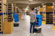 © Raymond Forbes LLC/Stocksy - Online delivery service warehouse with robots